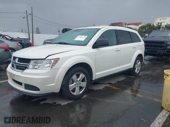 2013 Dodge Journey SE with VIN 3C4PDCAB1DT558033, listed as a IAAI auction lot 41804619 with 204,567 mi miles and . Bid and sale history available at carsss.com. Image 2.