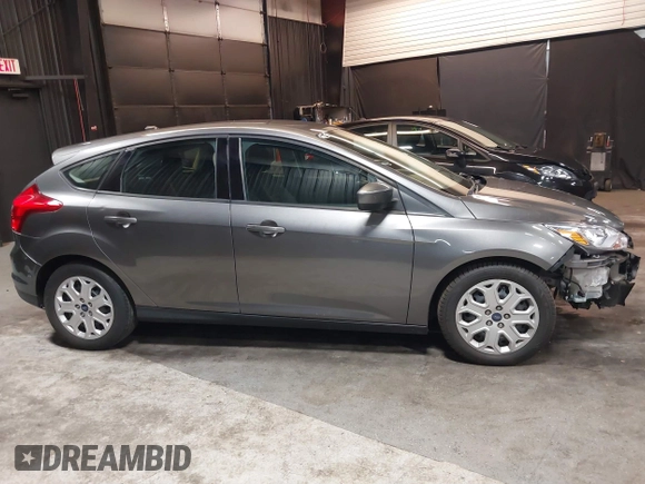 2012 Ford Focus SE with VIN 1FAHP3K22CL394088, listed as a IAAI auction lot 40953085 with 147,259 mi miles and . Bid and sale history available at carsss.com. Image 14.