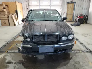 2003 Jaguar X-Type 3.0L z VIN SAJEA51C33WD25630, wystawiony jako Copart lot #57795475 z przebiegiem 135 514 mil mil oraz Szkody całkowita. Historia ofert i sprzedaży dostępna na DreamBid. Obrazek 5.