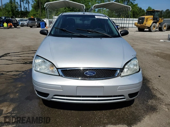 2007 Ford Focus S z VIN 1FAFP34N97W264411, wystawiony jako Copart lot #53251655 z przebiegiem 159 516 mil mil oraz Szkoda całkowita • Salvage title. Historia ofert i sprzedaży dostępna na DreamBid. Obrazek 5.