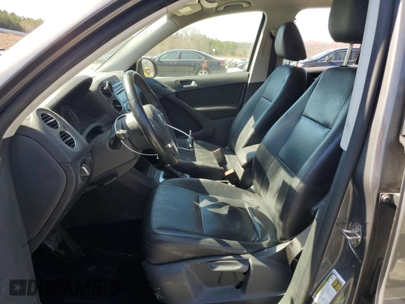 2014 Volkswagen Tiguan SE with VIN WVGAV3AX8EW619044, listed as a Copart auction lot 46990185 with 171,972 mi miles and Salvage title. Bid and sale history available at DreamBid. Image 7.