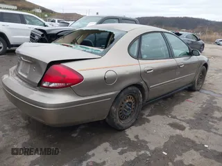 2005 Ford Taurus SE with VIN 1FAFP53215A127489, listed as a IAAI auction lot 40940239 with 127,180 mi miles. Bid and sale history available at carsss.com. Image 4.