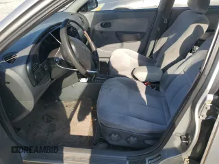 2004 Kia Spectra z VIN KNAFB121145308252, wystawiony jako Copart lot #53377555 z przebiegiem 206 439 mil mil oraz Szkoda całkowita • Salvage title. Historia ofert i sprzedaży dostępna na DreamBid. Obrazek 7.