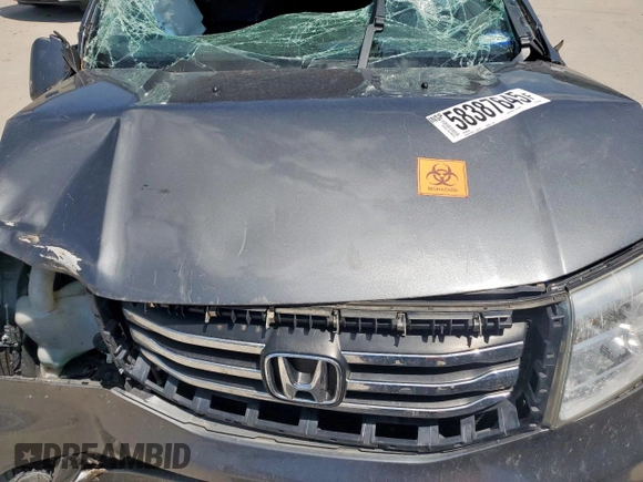 2013 Honda Pilot Touring z VIN 5FNYF3H97DB032389, wystawiony jako Copart lot #58387645 z przebiegiem Nie podano mil oraz Szkoda całkowita • Salvage title. Historia ofert i sprzedaży dostępna na DreamBid. Obrazek 12.