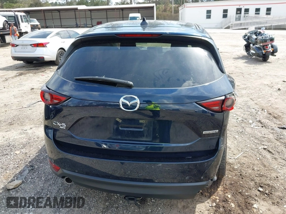 2021 Mazda CX-5 Grand Touring with VIN JM3KFBDM8M0484383, listed as a IAAI auction lot 41800786 with 58,617 mi miles. Bid and sale history available at carsss.com. Image 16.