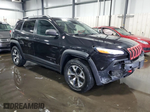 2014 Jeep Cherokee Trailhawk with VIN 1C4PJMBSXEW187981, listed as a Copart auction lot 56711885 with 157,317 mi miles and Salvage title. Bid and sale history available at DreamBid. Image 4.