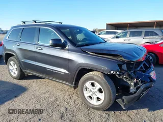 2014 Jeep Grand Cherokee Laredo with VIN 1C4RJEAG3EC218128, listed as a IAAI auction lot 40951611 with 119,596 mi miles and . Bid and sale history available at DreamBid. Image 1.