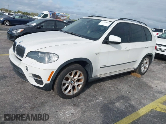 2011 BMW X5 35i with VIN 5UXZV4C54BL412770, listed as a IAAI auction lot 41618946 with 148,612 mi miles. Bid and sale history available at carsss.com. Image 2.