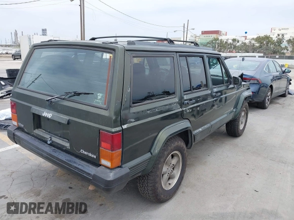 1996 Jeep Cherokee Sport z VIN 1J4FT68S6TL267408, wystawiony jako IAAI lot #42385629 z przebiegiem 268 753 mil mil oraz . Historia ofert i sprzedaży dostępna na DreamBid. Obrazek 4.
