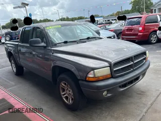 2003 Dodge Dakota Sport z VIN 1D7HL38N83S151291, wystawiony jako Copart lot #60267175 z przebiegiem 162 785 mil mil oraz Czysty tytuł • Clean title. Historia ofert i sprzedaży dostępna na DreamBid. Obrazek 1.