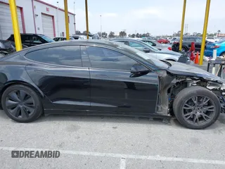 2023 Tesla Model S with VIN 5YJSA1E52PF528795, listed as a IAAI auction lot 42110660 with 21,243 mi miles and . Bid and sale history available at DreamBid. Image 13.