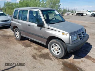 1998 Chevrolet Tracker z VIN 2CNBJ1369W6913198, wystawiony jako IAAI lot #42149796 z przebiegiem 97 696 mil mil oraz . Historia ofert i sprzedaży dostępna na DreamBid. Obrazek 1.