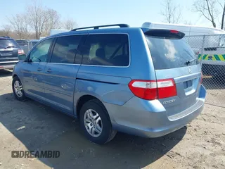 2007 Honda Odyssey EX-L with VIN 5FNRL38727B092077, listed as a IAAI auction lot 41972810 with 211,770 mi miles and . Bid and sale history available at DreamBid. Image 3.