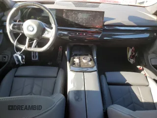 2024 BMW i5 eDrive40 with VIN WBY33FK01RCR76500, listed as a Copart auction lot 65026585 with 3,601 mi miles and Salvage title. Bid and sale history available at DreamBid. Image 8.