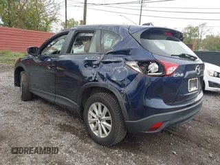 2013 Mazda CX-5 Sport with VIN JM3KE2BE1D0160254, listed as a IAAI auction lot 42256555 with 136,476 mi miles and . Bid and sale history available at DreamBid. Image 3.