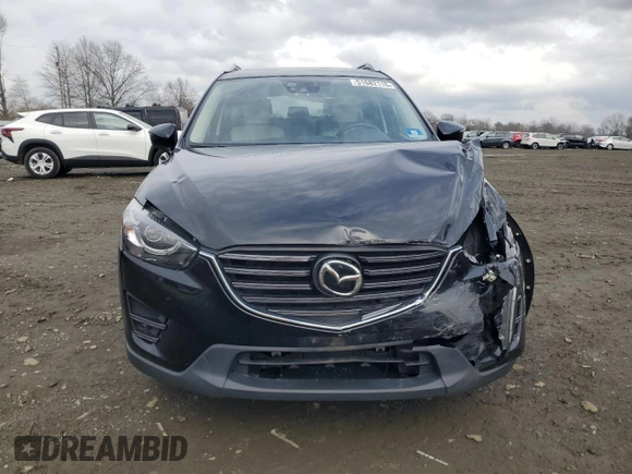 2016 Mazda CX-5 Grand Touring with VIN JM3KE4DY0G0727366, listed as a Copart auction lot 51682115 with 114,462 mi miles and Salvage Title. Bid and sale history available at carsss.com. Image 5.