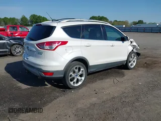 2013 Ford Escape Titanium with VIN 1FMCU0J97DUA70393, listed as a IAAI auction lot 41974106 with 73,548 mi miles and . Bid and sale history available at carsss.com. Image 4.