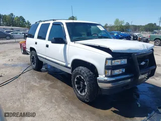 1997 Chevrolet Tahoe with VIN 1GNEK13R8VJ338626, listed as a IAAI auction lot 41976126 with 163,263 mi miles. Bid and sale history available at carsss.com. Image 1.