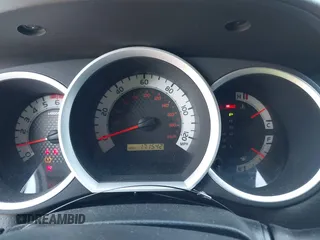 2014 Toyota Tacoma PreRunner with VIN 3TMKU4HN0EM040104, listed as a IAAI auction lot 41619179 with 171,542 mi miles and . Bid and sale history available at DreamBid. Image 7.