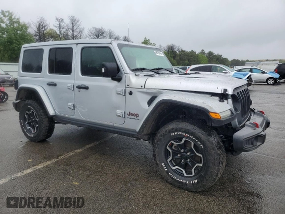 2023 Jeep Wrangler Rubicon with VIN 1C4JJXFM4PW589923, listed as a Copart auction lot 58725465 with 9,814 mi miles and Salvage title. Bid and sale history available at DreamBid. Image 4.