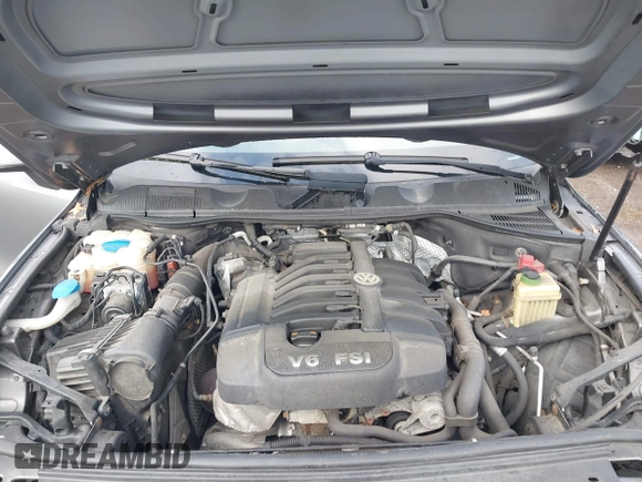 2013 Volkswagen Touareg Lux with VIN WVGEF9BPXDD000679, listed as a IAAI auction lot 41956471 with 117,465 mi miles and . Bid and sale history available at DreamBid. Image 10.