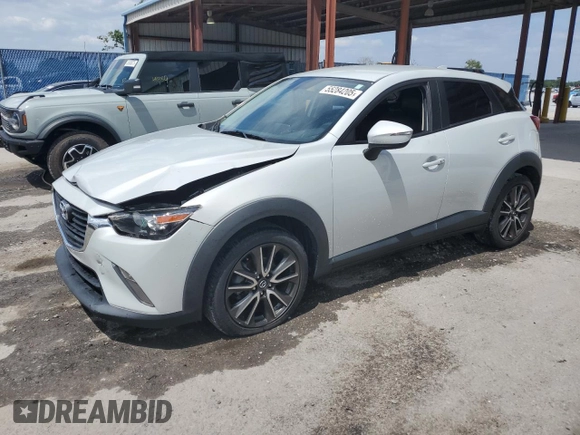 2017 Mazda CX-3 Touring z VIN JM1DKDC78H0150588, wystawiony jako Copart lot #55284205 z przebiegiem 78 923 mil mil oraz Szkoda całkowita • Salvage title. Historia ofert i sprzedaży dostępna na DreamBid. Obrazek 1.