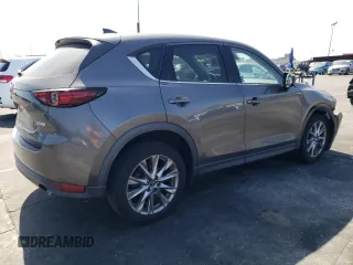2019 Mazda CX-5 Grand Touring with VIN JM3KFADM6K1641992, listed as a Copart auction lot 57862345 with 37,100 mi miles and Salvage title. Bid and sale history available at DreamBid. Image 3.