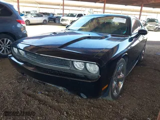 2013 Dodge Challenger SXT with VIN 2C3CDYAG1DH629087, listed as a IAAI auction lot 41993728 with 226,948 mi miles. Bid and sale history available at carsss.com. Image 2.