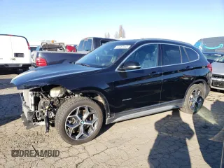 2018 BMW X1 xDrive28i with VIN WBXHT3C38J5K24660, listed as a Copart auction lot 44387043 with 59,786 mi miles. Bid and sale history available at carsss.com. Image 1.