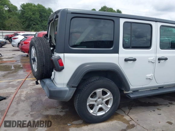 2019 Jeep Wrangler Unlimited Sport S with VIN 1C4HJXDN3KW689739, listed as a IAAI auction lot 42358604 with 73,271 mi miles and . Bid and sale history available at DreamBid. Image 18.