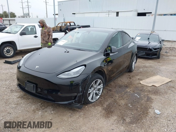 2023 Tesla Model Y Long Range z VIN 7SAYGDEEXPA181114, wystawiony jako IAAI lot #41564617 z przebiegiem 64 990 mil mil oraz . Historia ofert i sprzedaży dostępna na DreamBid. Obrazek 22.