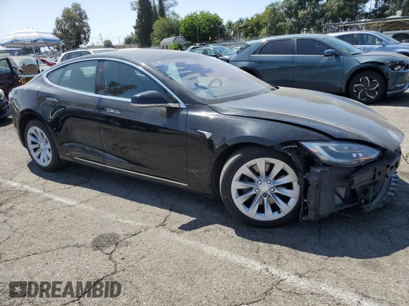 2018 Tesla Model S 75D с VIN 5YJSA1E24JF248762, выставлен на аукционе Copart как лот 61501075 с пробегом 63 802 миль миль и Списание • Salvage title. История ставок и продаж доступна на DreamBid. Изображение 4.