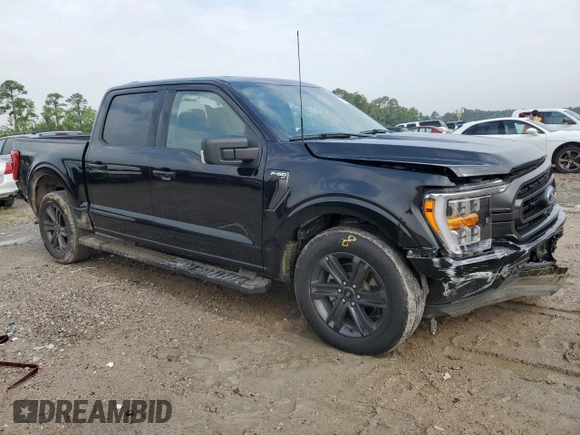 2023 Ford F-150 XL with VIN 1FTEW1C59PFC27499, listed as a Copart auction lot 54453255 with 58,554 mi miles and Salvage title. Bid and sale history available at DreamBid. Image 4.