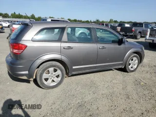 2013 Dodge Journey American Value with VIN 3C4PDCAB8DT590509, listed as a Copart auction lot 57347375 with 203,642 mi miles and Clean title. Bid and sale history available at DreamBid. Image 3.