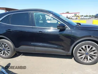2020 Ford Escape Titanium z VIN 1FMCU9J97LUB18350, wystawiony jako IAAI lot #42574736 z przebiegiem 82 551 mil mil oraz . Historia ofert i sprzedaży dostępna na DreamBid. Obrazek 14.