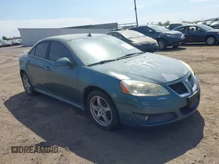 2009 Pontiac G6 1SB with VIN 1G2ZJ57K594261692, listed as a IAAI auction lot 42802373 with 200,469 mi miles and . Bid and sale history available at DreamBid. Image 1.