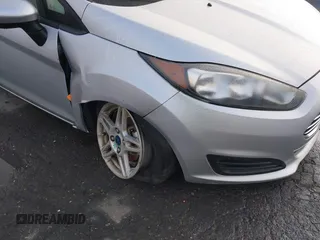 2019 Ford Fiesta SE z VIN 3FADP4EJ7KM147864, wystawiony jako IAAI lot #41692160 z przebiegiem 87 417 mil mil oraz . Historia ofert i sprzedaży dostępna na DreamBid. Obrazek 6.