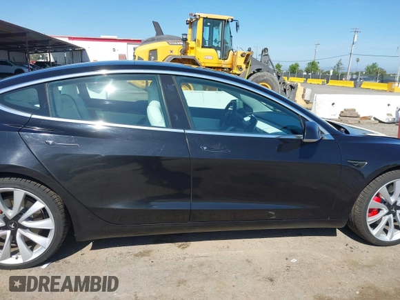 2019 Tesla Model 3 Long Range with VIN 5YJ3E1EB9KF231742, listed as a IAAI auction lot 42114608 with 86,657 mi miles and . Bid and sale history available at DreamBid. Image 14.