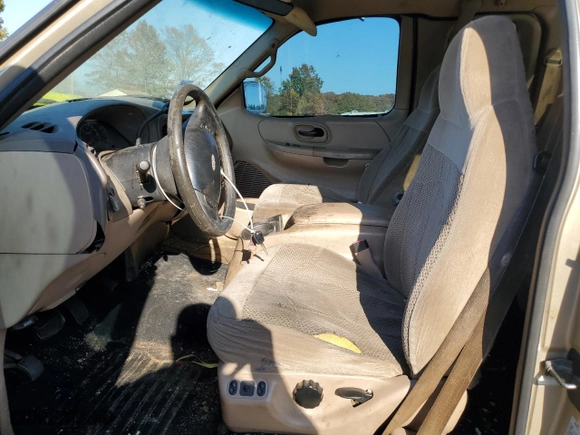 1999 Ford F-150 Work Series with VIN 1FTRX18WXXNA56977, listed as a Copart auction lot 77179044 with 0 mi miles and Salvage Title. Bid and sale history available at carsss.com. Image 7.