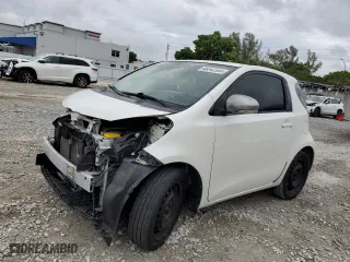 2014 Scion iQ with VIN JTNJJXB07EJ027099, listed as a Copart auction lot 46042385 with 84,316 mi miles and Salvage Title. Bid and sale history available at carsss.com. Image 1.