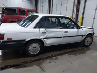1990 Toyota Camry z VIN JT2SV21E5L3398379, wystawiony jako IAAI lot #41699413 z przebiegiem 100 136 mil mil oraz . Historia ofert i sprzedaży dostępna na DreamBid. Obrazek 12.