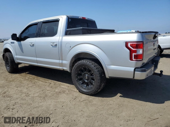 2018 Ford F-150 XL with VIN 1FTEW1CGXJFB40297, listed as a Copart auction lot 69642404 with 92,561 mi miles and Salvage title. Bid and sale history available at DreamBid. Image 2.