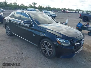 2015 Mercedes-Benz C-Class C 300 with VIN 55SWF4JB7FU053125, listed as a IAAI auction lot 42038080 with 148,553 mi miles. Bid and sale history available at carsss.com. Image 1.