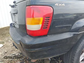 1999 Jeep Grand Cherokee Limited with VIN 1J4GW68S8XC588500, listed as a IAAI auction lot 41484787 with 161,961 mi miles. Bid and sale history available at carsss.com. Image 15.