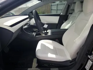 2025 Tesla Model 3 Long Range with VIN 5YJ3E1EA8SF984931, listed as a Copart auction lot 61259345 with 2,248 mi miles and Salvage title. Bid and sale history available at DreamBid. Image 7.