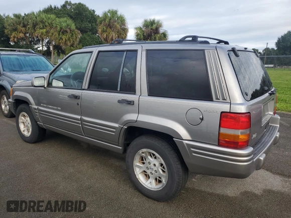 1998 Jeep Grand Cherokee Limited with VIN 1J4GZ78S2WC222768, listed as a Copart auction lot 73942154 with Not provided miles and Salvage title. Bid and sale history available at DreamBid. Image 2.