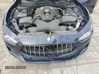 2018 Maserati Ghibli z VIN ZAM57XSA5J1287424, wystawiony jako Copart lot #71215154 z przebiegiem 20 029 mil mil oraz Szkoda całkowita • Salvage title. Historia ofert i sprzedaży dostępna na DreamBid. Obrazek 11.
