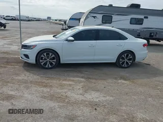 2021 Volkswagen Passat SE z VIN 1VWSA7A30MC016627, wystawiony jako IAAI lot #41904846 z przebiegiem 56 969 mil mil oraz . Historia ofert i sprzedaży dostępna na DreamBid. Obrazek 14.