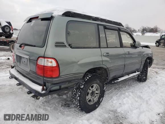2002 Lexus LX 470 z VIN JTJHT00W923514121, wystawiony jako Copart lot #87761105 z przebiegiem 247 752 mil mil oraz Szkody całkowita. Historia ofert i sprzedaży dostępna na DreamBid. Obrazek 3.