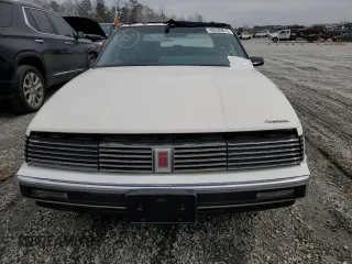 1987 Oldsmobile Toronado with VIN 1G3EZ1130HU307201, listed as a Copart auction lot 49290815 with 104,837 mi miles and Salvage Title. Bid and sale history available at DreamBid. Image 5.